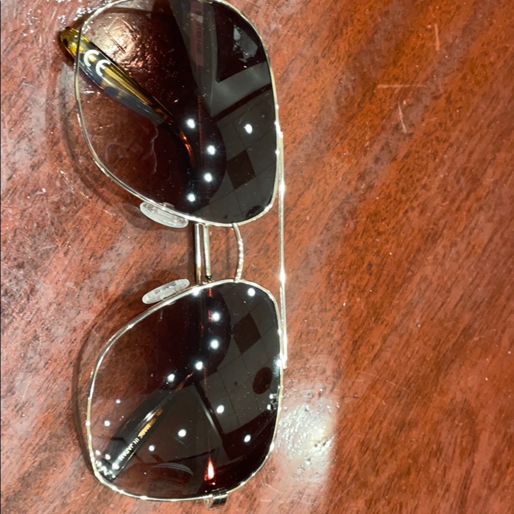 Sun glasses Brown lenses and yellow metal.